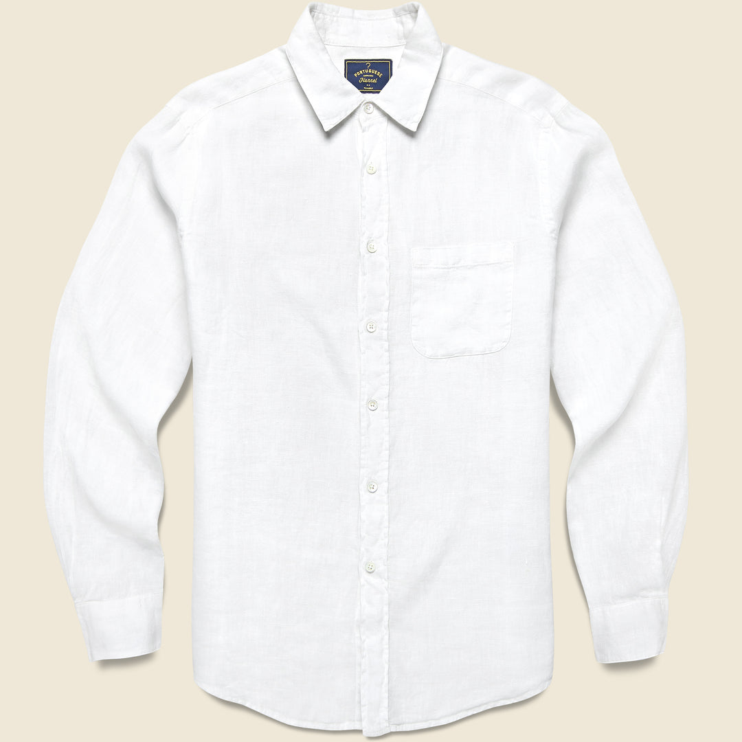 Classic men’s denim jacket from STAG Provisions layered over a white T-shirt for an effortless date night look.